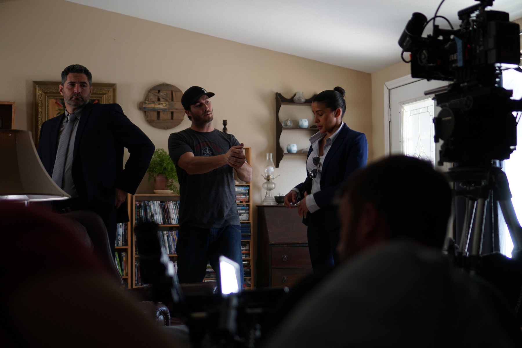 Derrek Horn directing actors on the interior set of Preparation Z