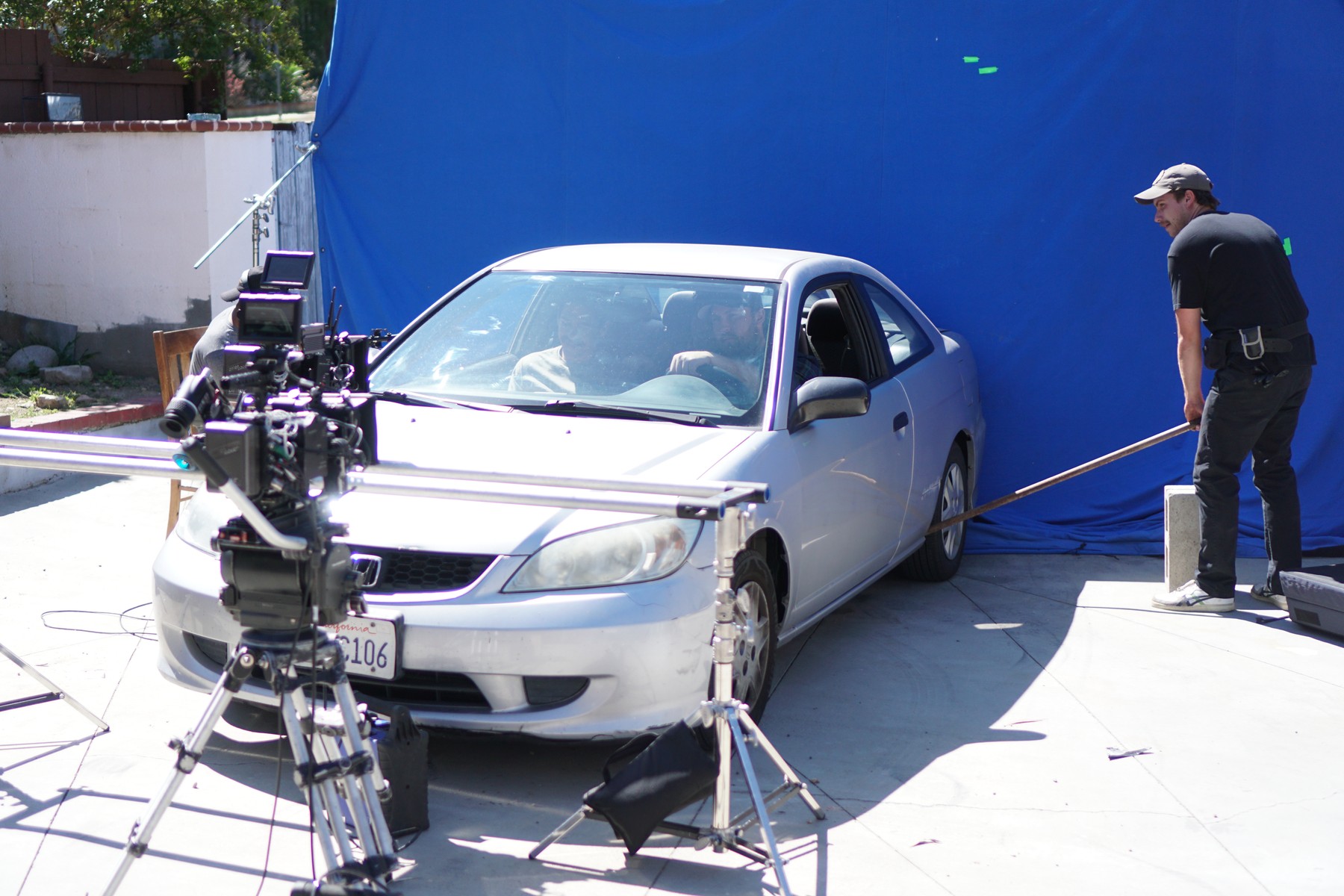 Car scene photographed against a blue screen