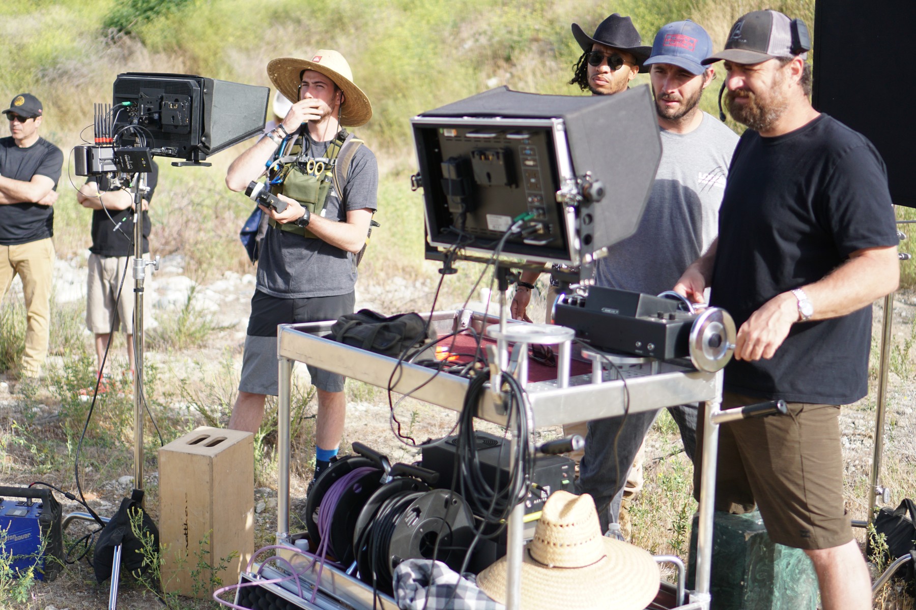 Derrek Horn and the camera team reviewing an exterior setup